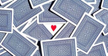 How to tell fortunes on a guy with a regular deck of playing cards on hand?